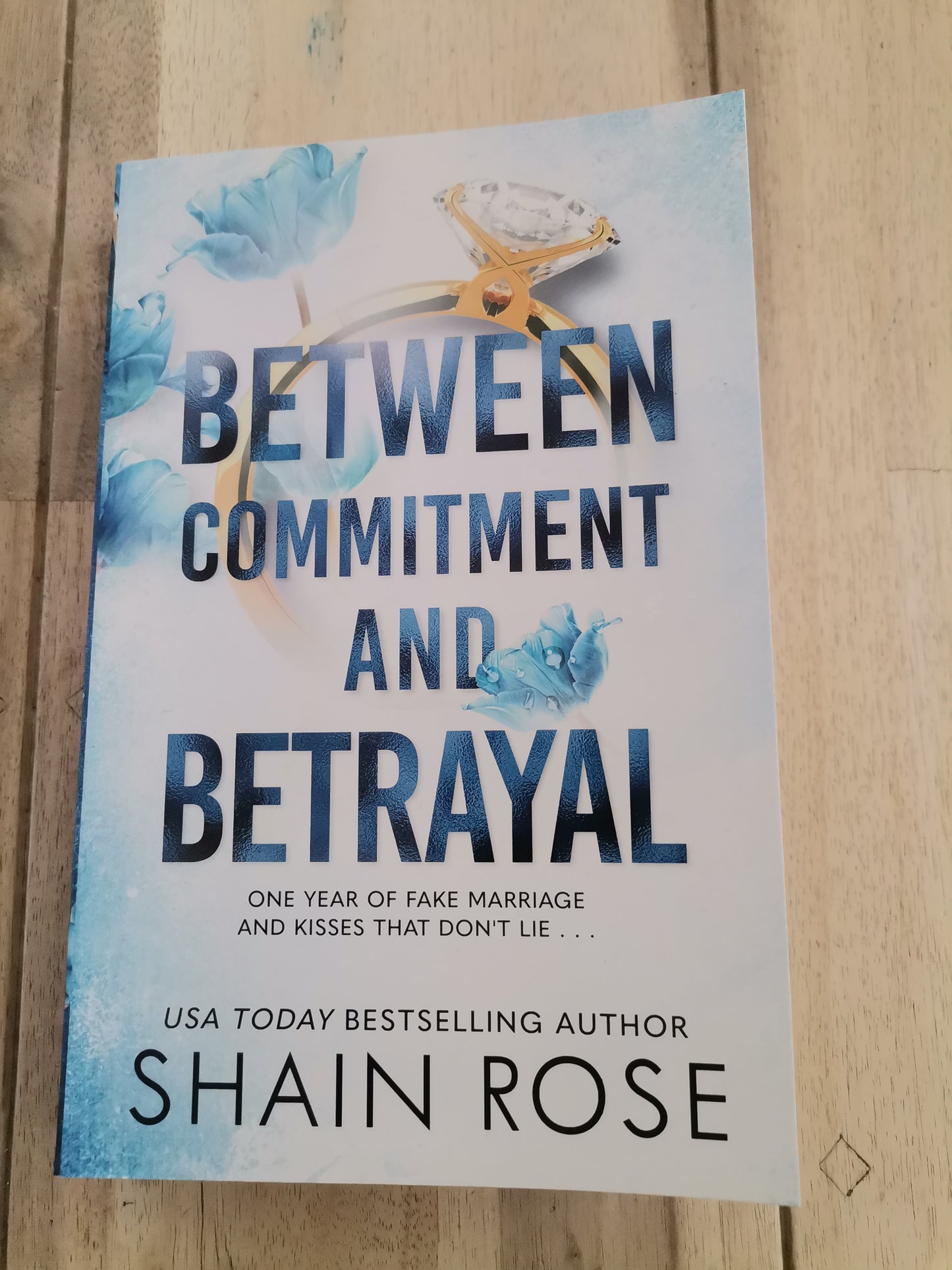 Between Commitment and Betrayal by Shaine Rose