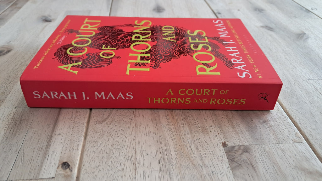 A Court of Thorns and Roses – Sarah J. Maas