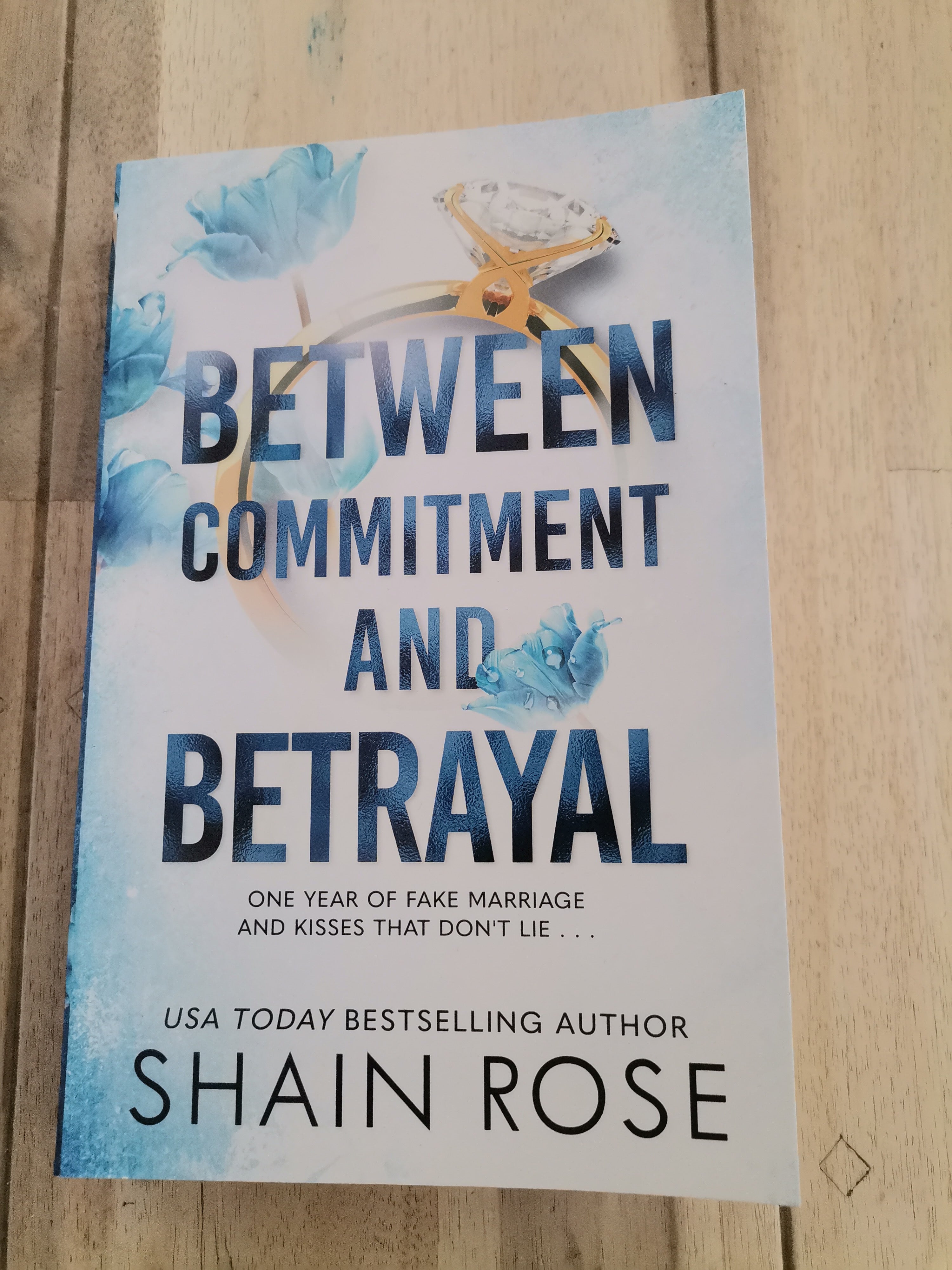 Between Commitment and Betrayal by Shaine Rose
